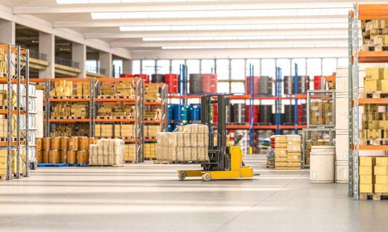 forklift truck transporting parcels in a warehouse